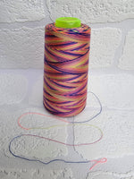 Load image into Gallery viewer, Rainbow thread spools, beautiful shades of the rainbow on the one thread. 3000 yards per cone, suitable for all sewing.
