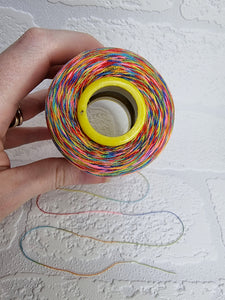 Rainbow thread spools, beautiful shades of the rainbow on the one thread. 3000 yards per cone, suitable for all sewing.