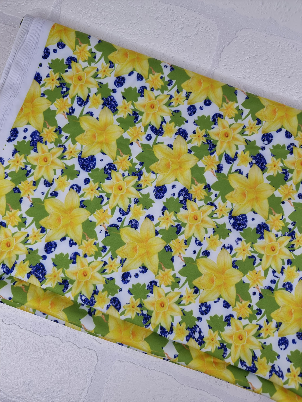 Daffodils on white background printed onto swim UV50+ fabric