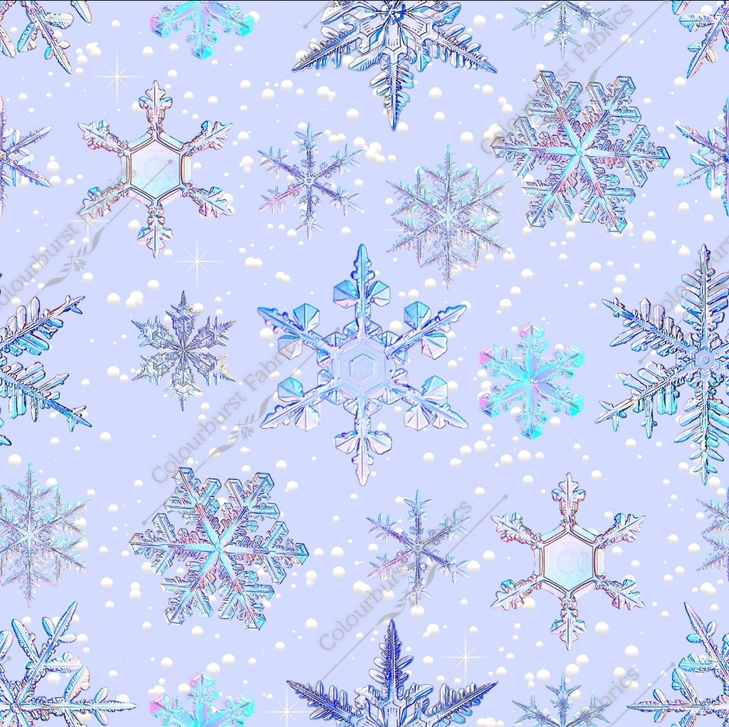 Snowflakes in varying sizes in holographic metallic form on a light baby blue/lilac background. Seamless design for custom fabric printing onto our 22 bases.
