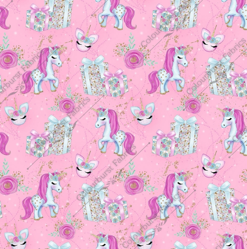 Glittery sparkly white and pink unicorns on a pink faux glitter background with christmas presents.