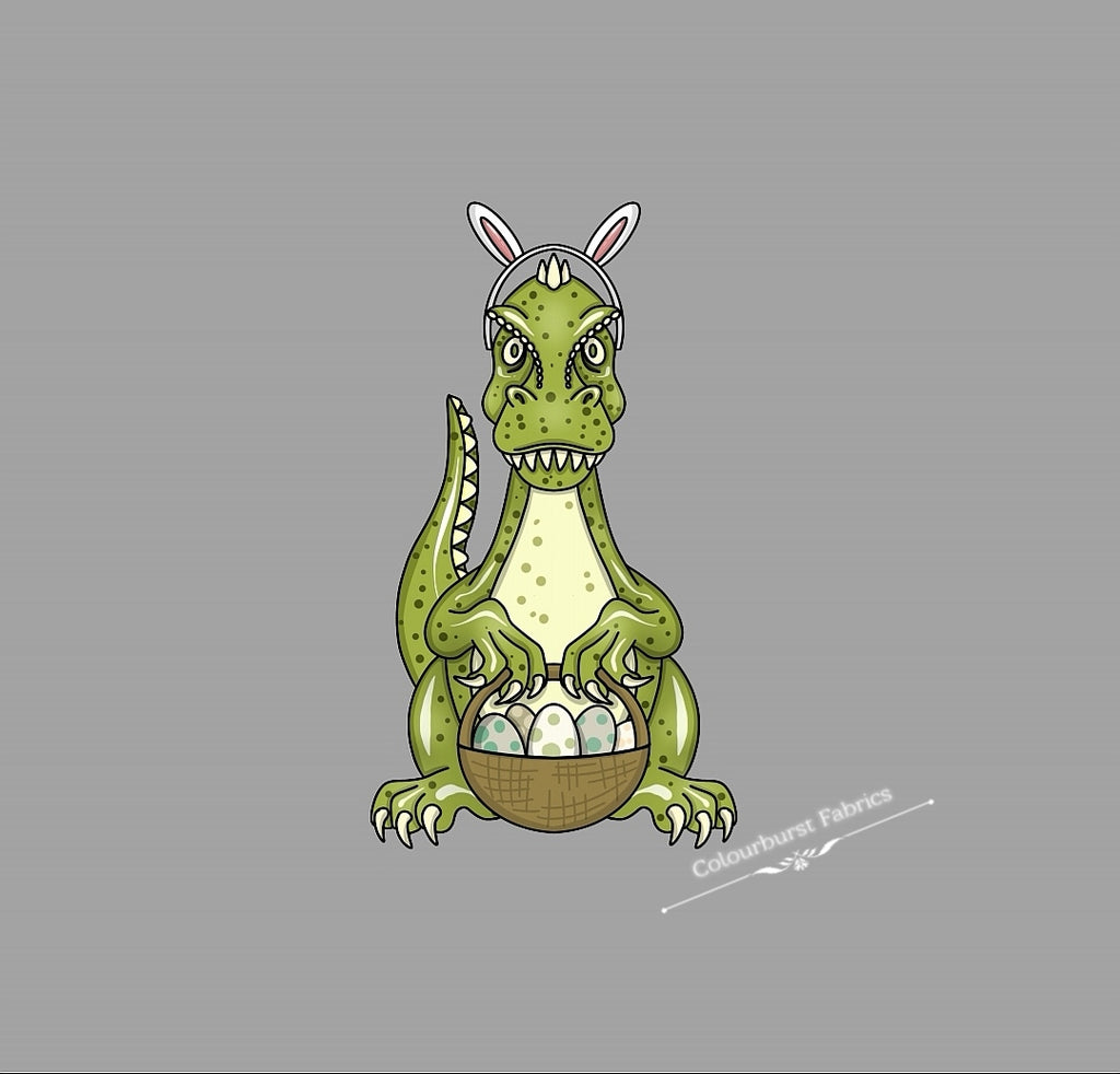 Green dinosaur bunny holding an easyer basket filled with spotted eggs and wearing easter bunny ears. On a grey background. Panels available in 3 sizes, infant, child and adult. Exclusive panel can be printed onto our 22 bases