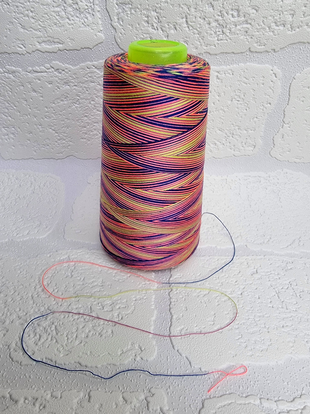 Rainbow thread spools, beautiful shades of the rainbow on the one thread. 3000 yards per cone, suitable for all sewing.