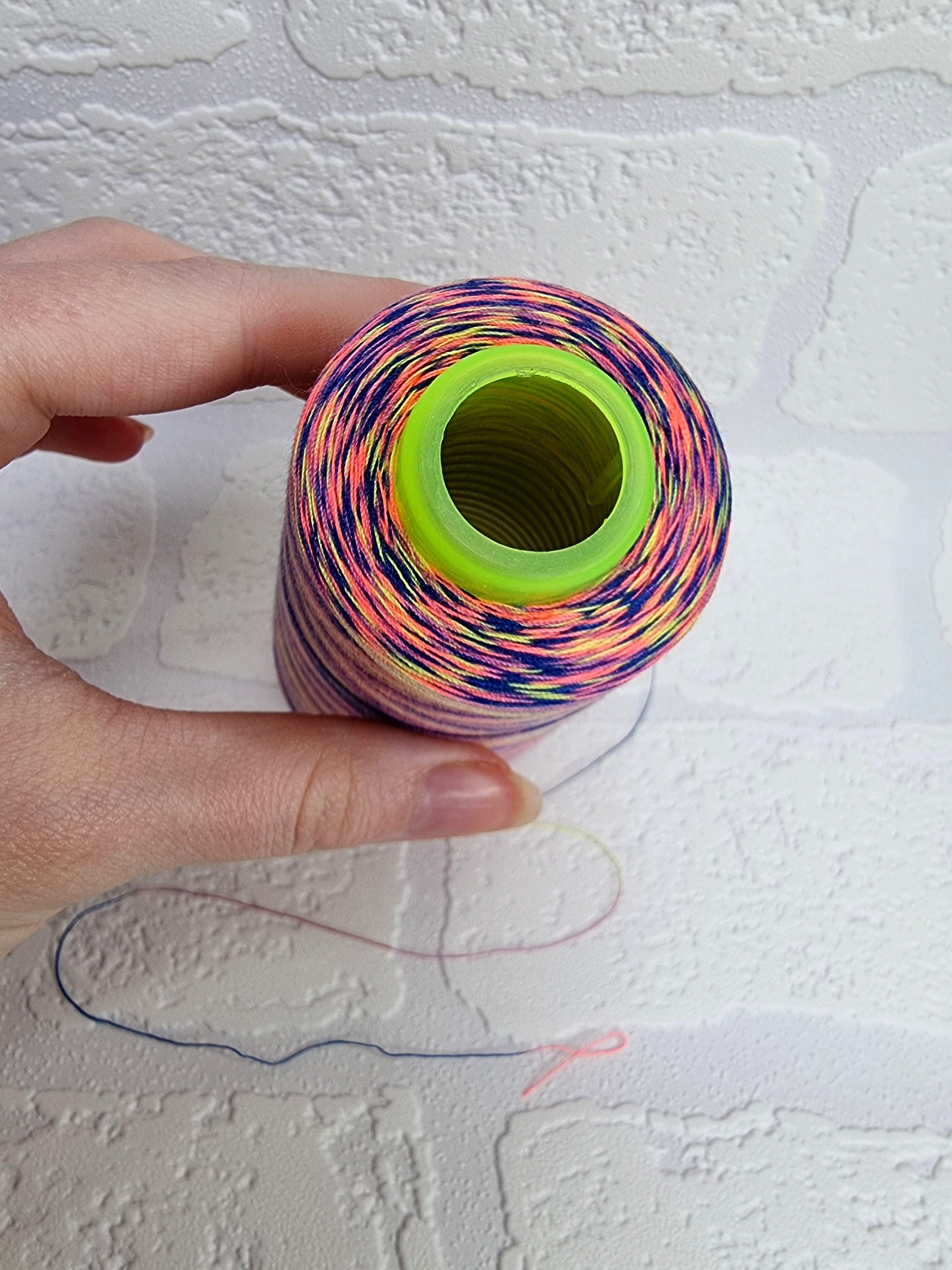 Rainbow thread spools, beautiful shades of the rainbow on the one thread. 3000 yards per cone, suitable for all sewing.