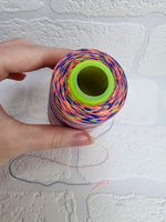 Load image into Gallery viewer, Rainbow thread spools, beautiful shades of the rainbow on the one thread. 3000 yards per cone, suitable for all sewing.
