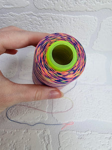 Rainbow thread spools, beautiful shades of the rainbow on the one thread. 3000 yards per cone, suitable for all sewing.