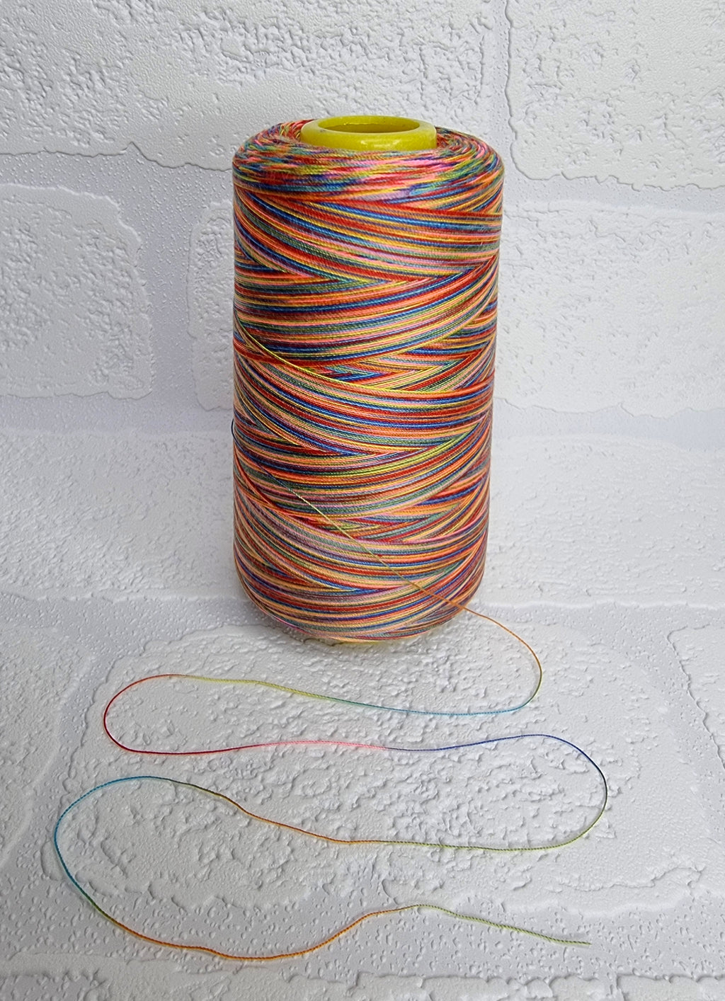 Rainbow thread spools, beautiful shades of the rainbow on the one thread. 3000 yards per cone, suitable for all sewing.