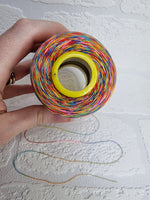 Load image into Gallery viewer, Rainbow thread spools, beautiful shades of the rainbow on the one thread. 3000 yards per cone, suitable for all sewing.
