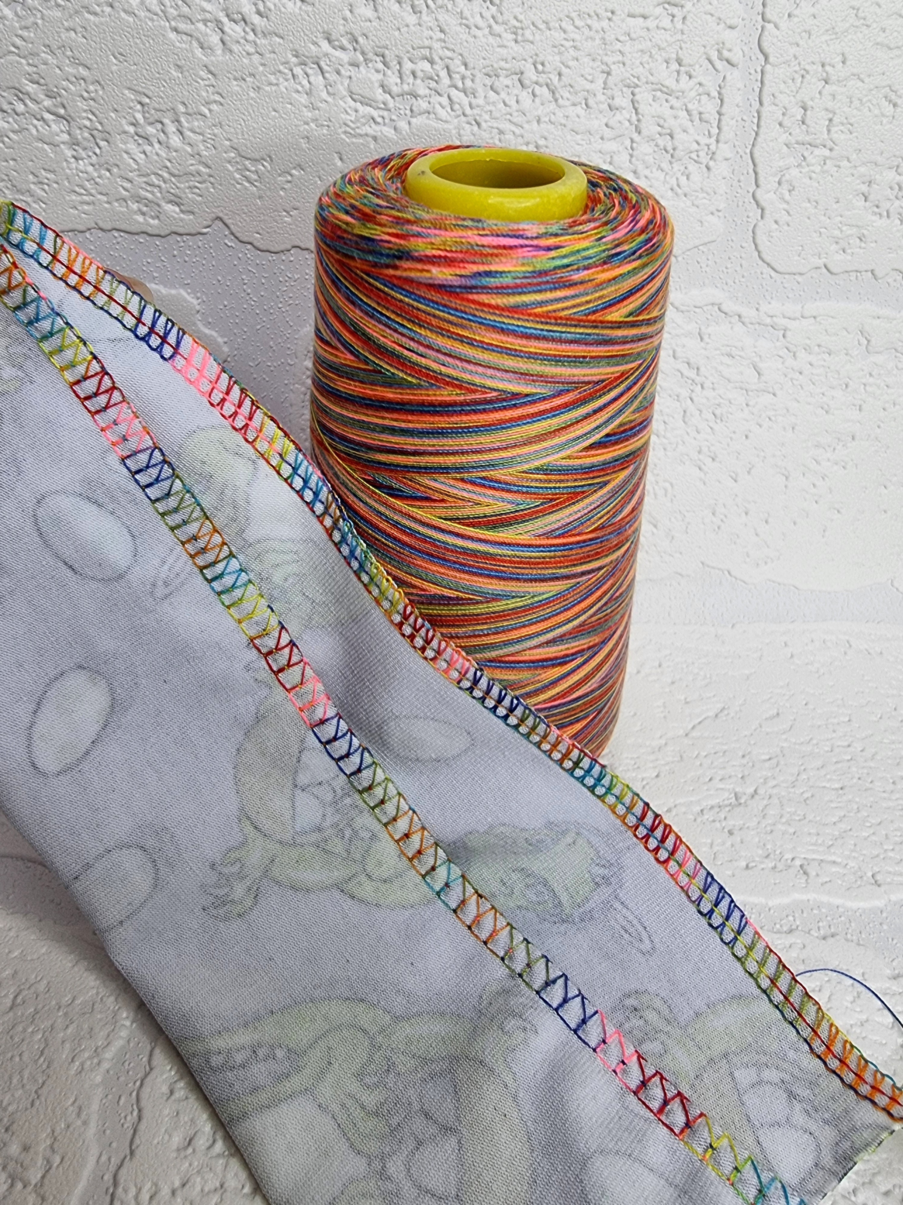 Rainbow thread spools, beautiful shades of the rainbow on the one thread. 3000 yards per cone, suitable for all sewing.
