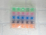 Load image into Gallery viewer, 25 x colourful bobbins in storage box/organiser
