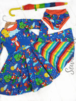 Load image into Gallery viewer, Beautiful dress made to show off our adorable fox design. Picture shows Adorable foxes in cute habitats, one with unbrella under rain cloud, one sleeping on tree stump, one soaking up the rain and one standing under the sun. Exclusive design for pre-order at Colourburst Fabrics 
