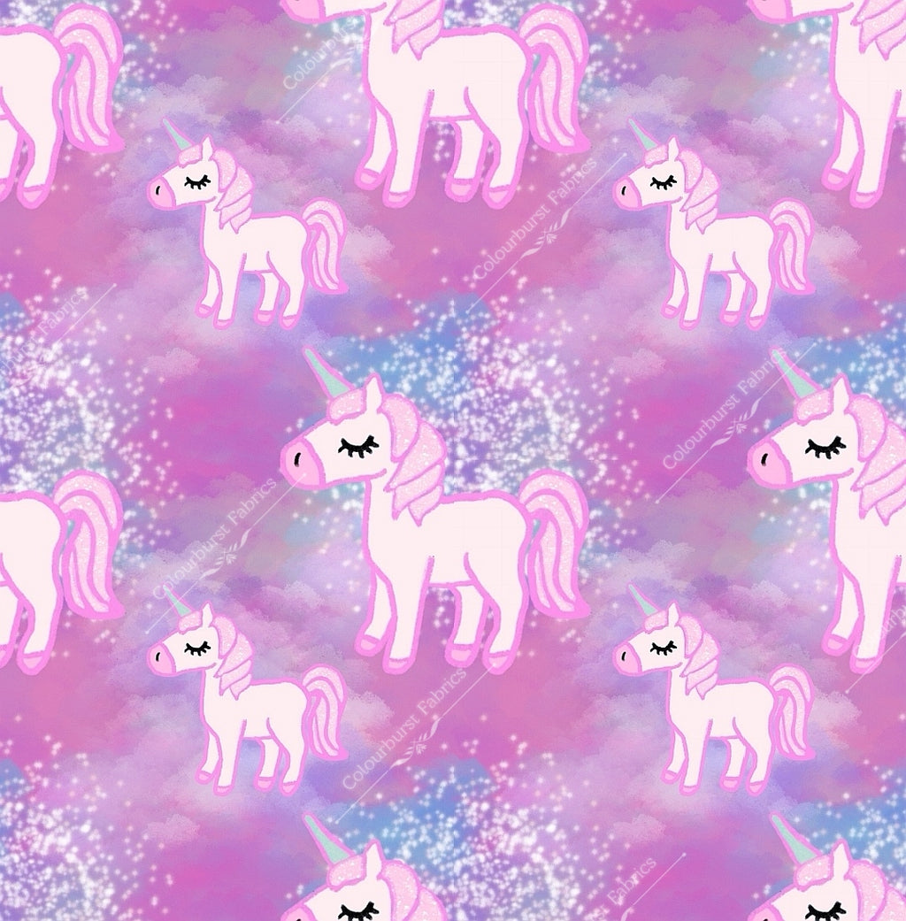 Pink unicorns on an ombre pink and white background. Seamless design for custom fabric printing onto our 22 bases