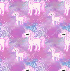 Pink unicorns on an ombre pink and white background. Seamless design for custom fabric printing onto our 22 bases