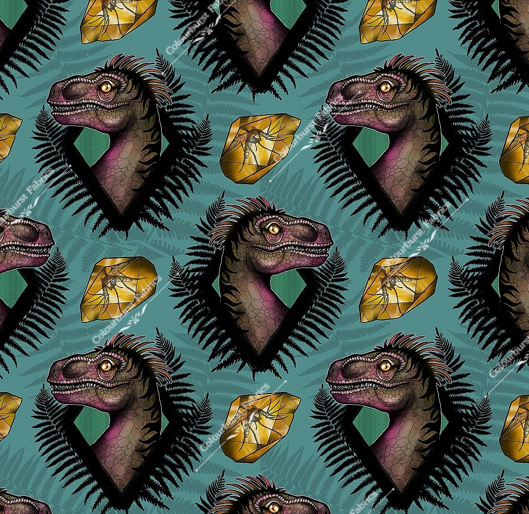 Realistic dinosaur heads in fern border on blue background with fossil in amber. Seamless design for custom fabric printing onto our 22 bases