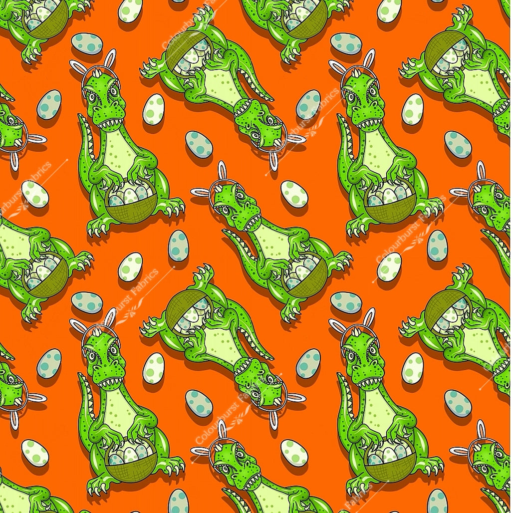 Green dinosaur bunnies holding easter eggs in basket with rabbit ear headband on. Bright orange background. Exclusive design for custom fabric printing onto our 22 bases.